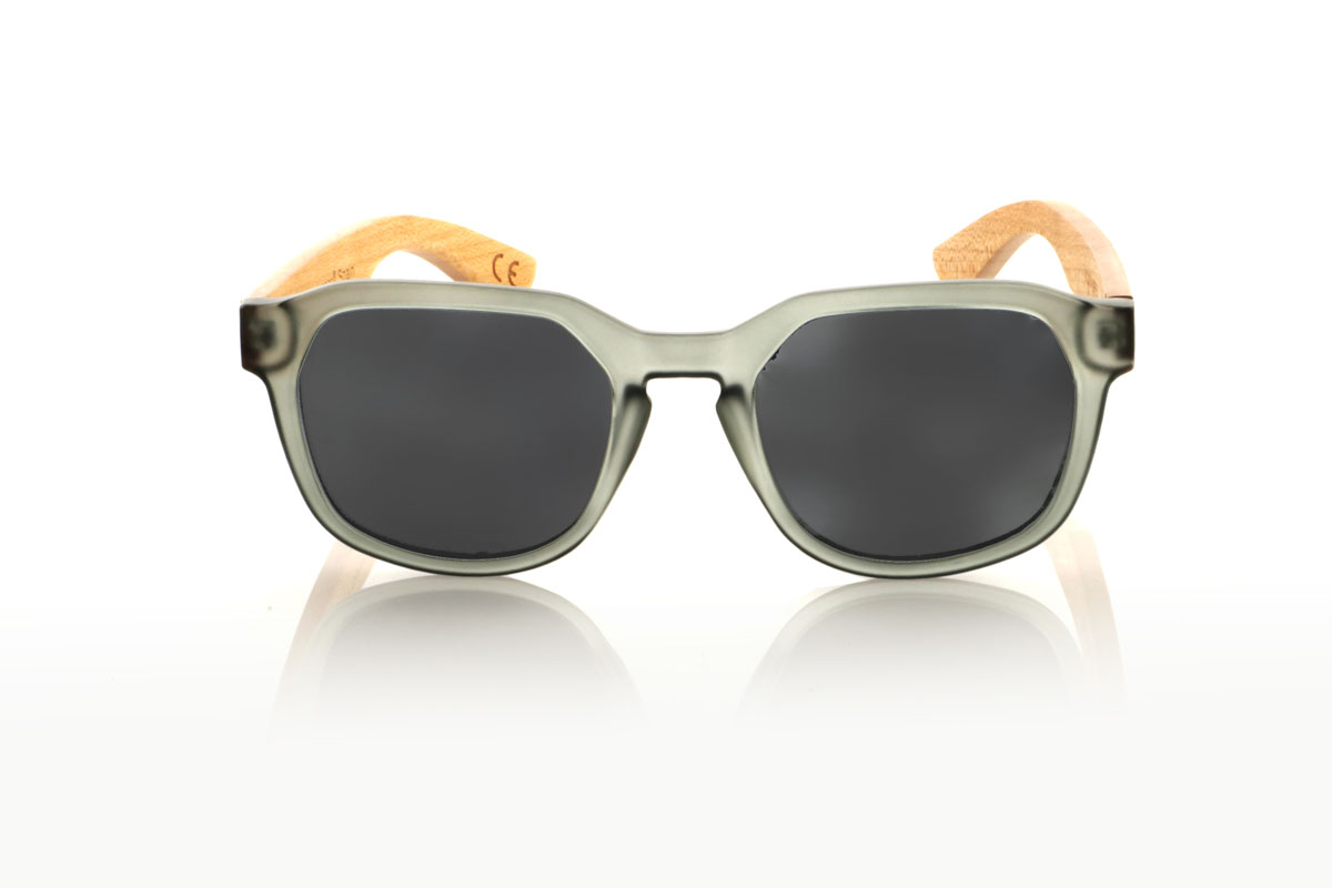 Wood eyewear of Maple MOON GREY. MOON GRAY glasses with transparent matte gray PC hexagonal frame and maple wood temples. Ideal for adding a unique touch to your style, these glasses fuse modernity with the natural charm of wood. They are super comfortable and perfect to protect you from the sun with a lot of style. Designed for women who love to combine trends and have a commitment to the environment. Try them and give your look an extra touch of originality. Front measurement: 148x50mm. Caliber: 53 for Wholesale & Retail | Root Sunglasses® 